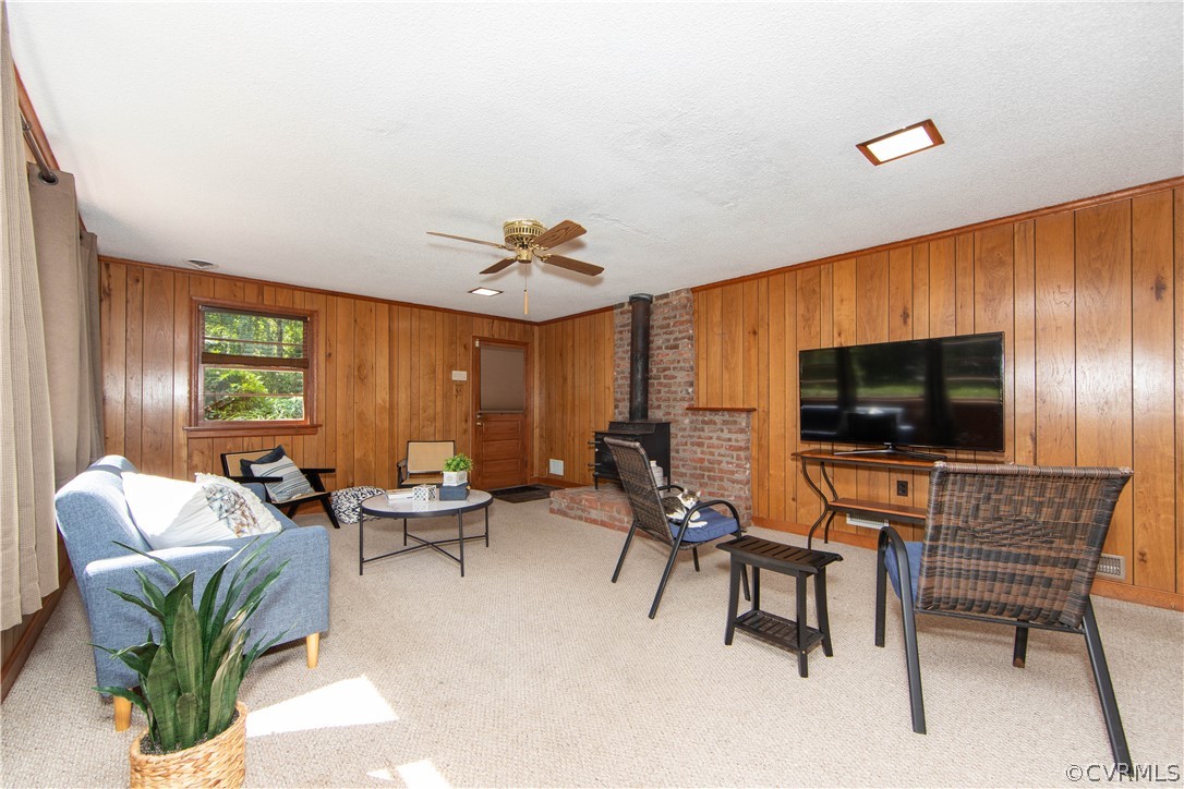 7706 Comanche Drive Richmond, VA 23225 - Photo 21 of 42 a living room with furniture and a flat screen tv