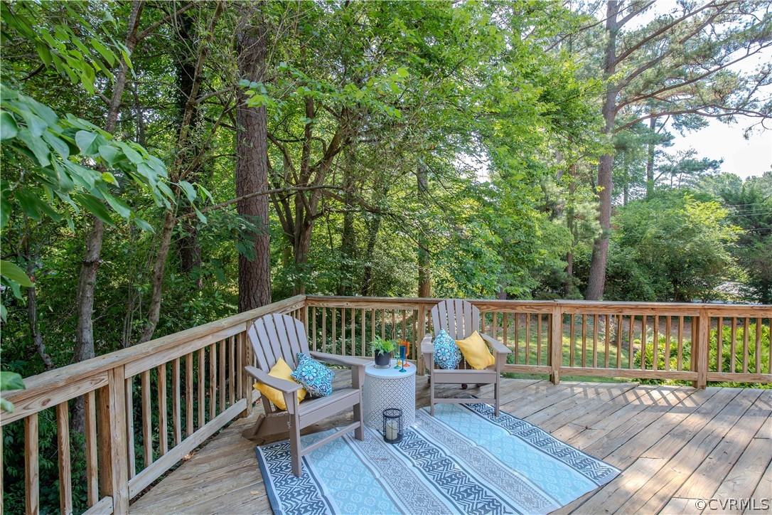 7706 Comanche Drive Richmond, VA 23225 - Photo 30 of 42 a view of roof deck with furniture and trees around