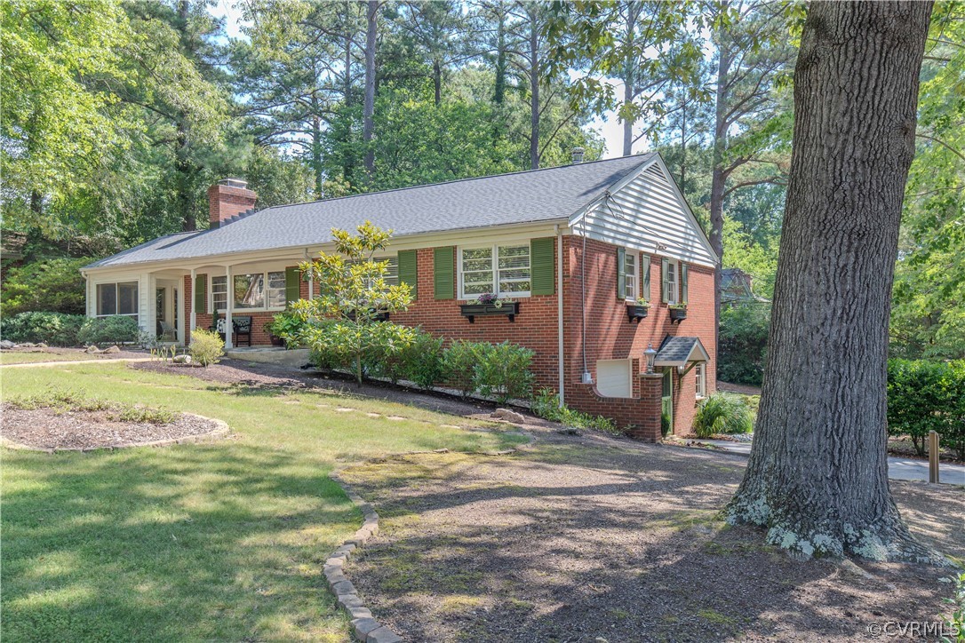 7706 Comanche Drive Richmond, VA 23225 - Photo 3 of 42 a view of a house with backyard and a tree