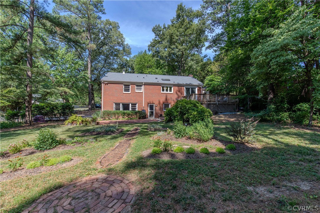 7706 Comanche Drive Richmond, VA 23225 - Photo 40 of 42 a view of backyard of house with green space