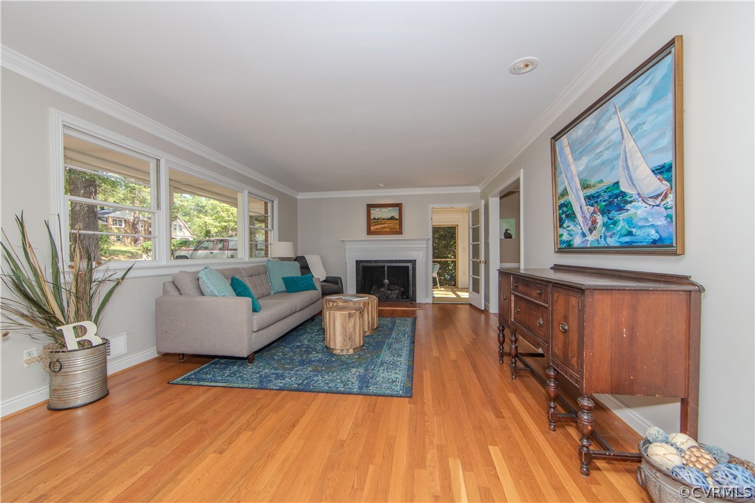 7706 Comanche Drive Richmond, VA 23225 - Photo 6 of 42 a living room with furniture large window and wooden floor