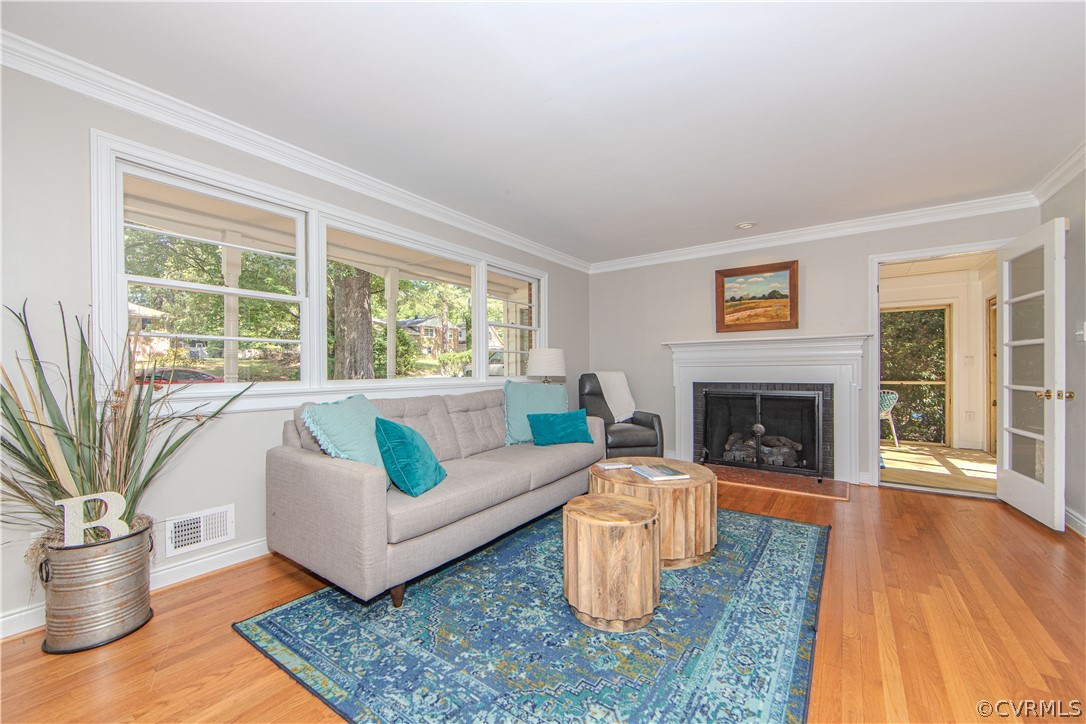 7706 Comanche Drive Richmond, VA 23225 - Photo 7 of 42 a living room with furniture and a fireplace