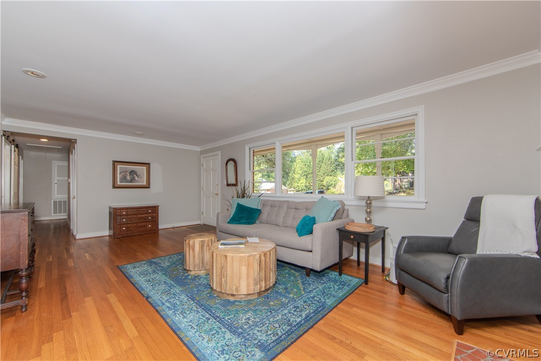 7706 Comanche Drive Richmond, VA 23225 - Photo 8 of 42 a living room with furniture and a table