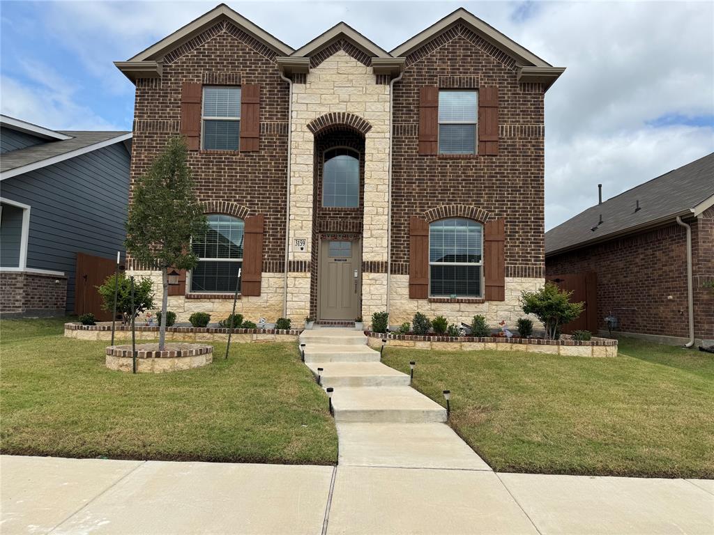 3159 Blossom Trail Crandall, TX 75114 - Photo 2 of 25 a front view of a house with a yard