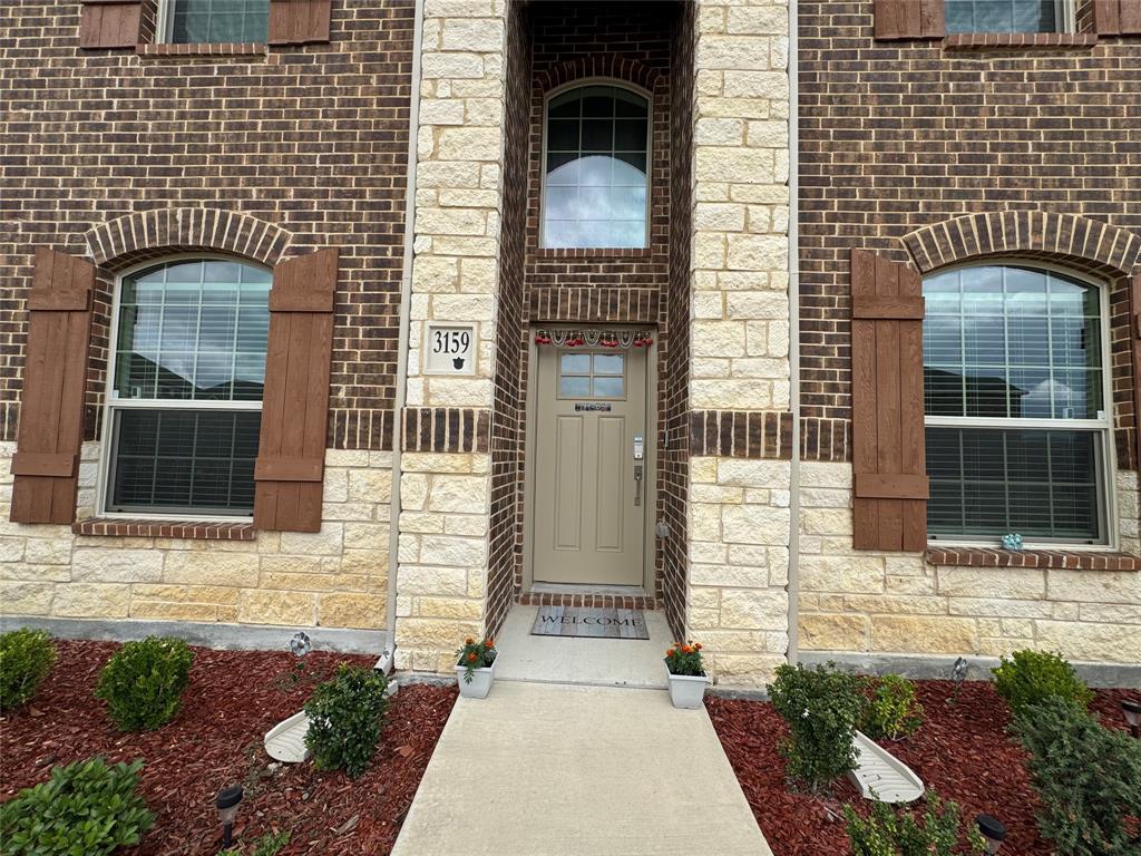 3159 Blossom Trail Crandall, TX 75114 - Photo 3 of 25 a front view of a house with a garden