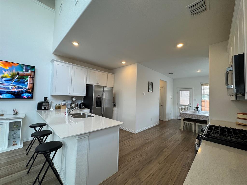 3159 Blossom Trail Crandall, TX 75114 - Photo 7 of 25 a living room with furniture and a flat screen tv