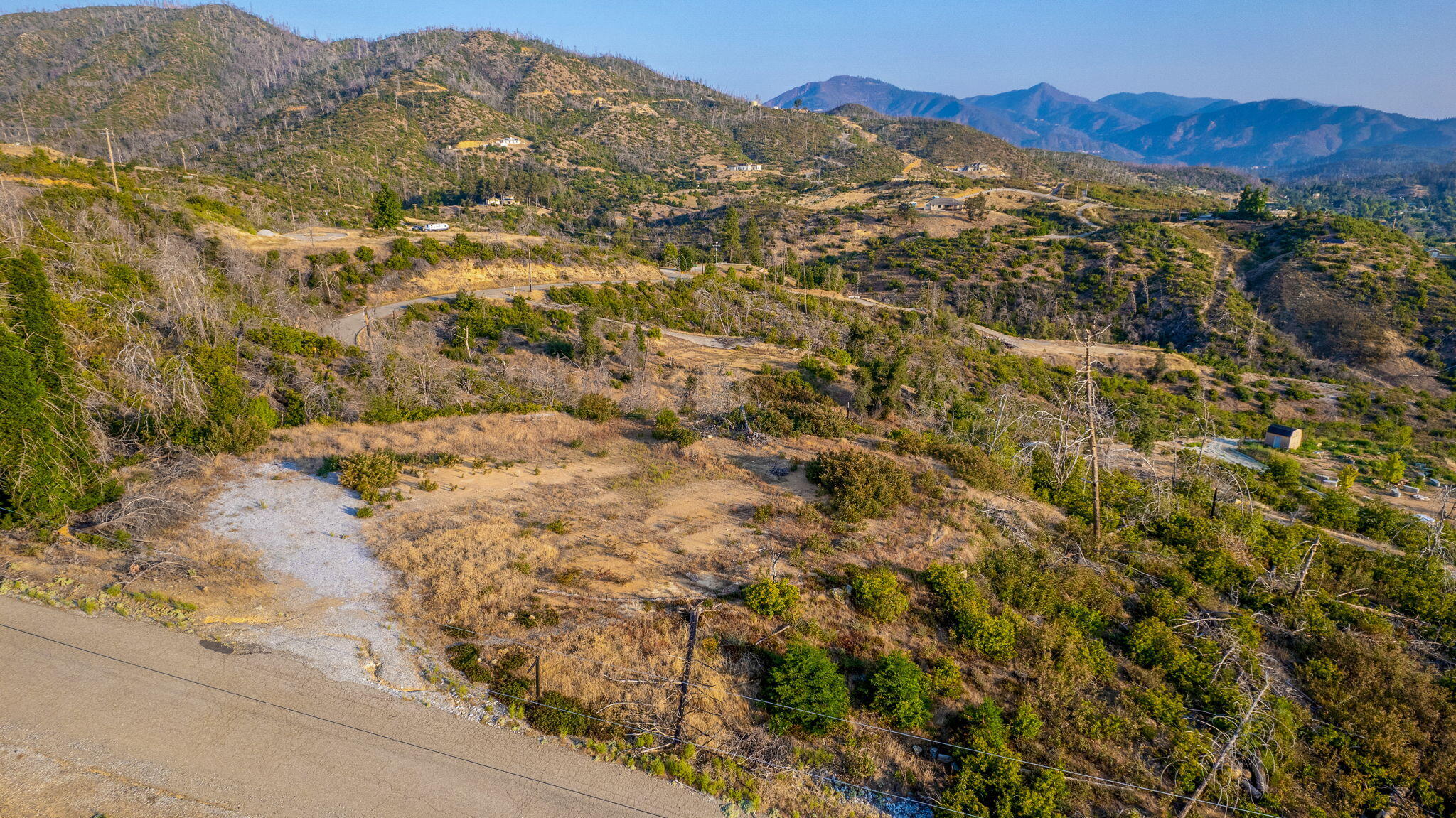 15346 Blackbart Road Shasta, CA 96087 - Photo 17 of 24 a view of a mountain range in a cloudy sky
