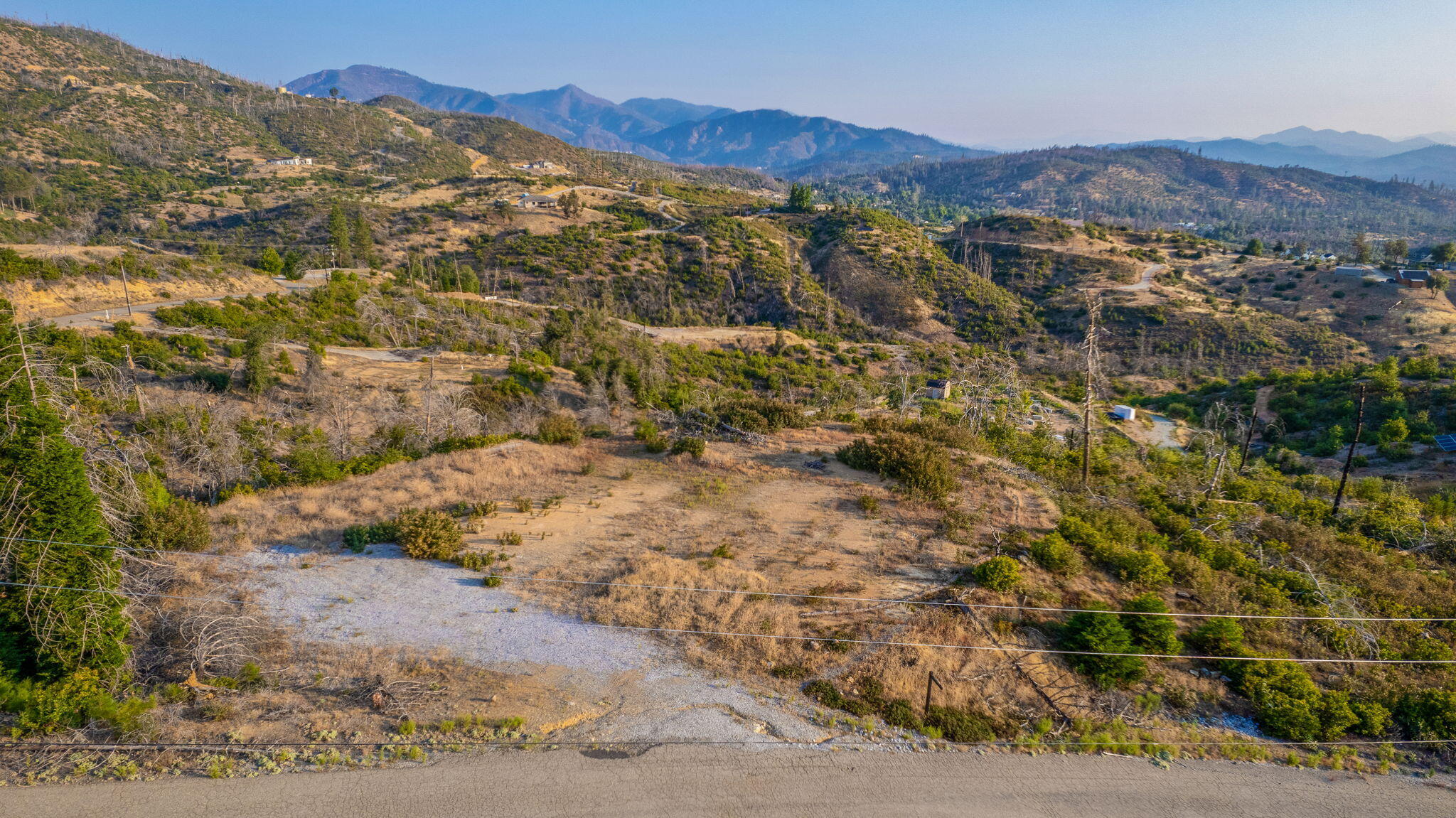 15346 Blackbart Road Shasta, CA 96087 - Photo 19 of 24 a view of a dry field with mountains in the background