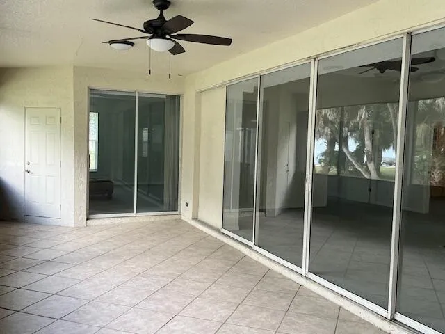 a view of a entryway with a glass door shower and fireplace