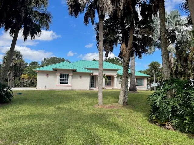 front view of a house with a big yard