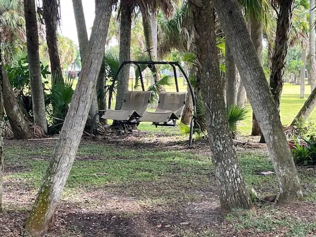 a backyard of a house with lots of green space