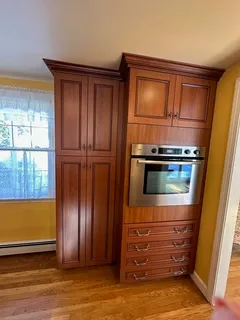 a view of kitchen with refrigerator and window