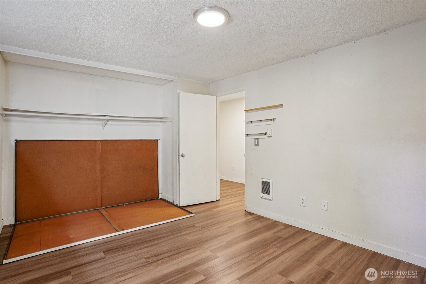 31003 14th Avenue South, Unit H8 Federal Way, WA 98003 - Photo 13 of 17 a view of empty room with wooden floor