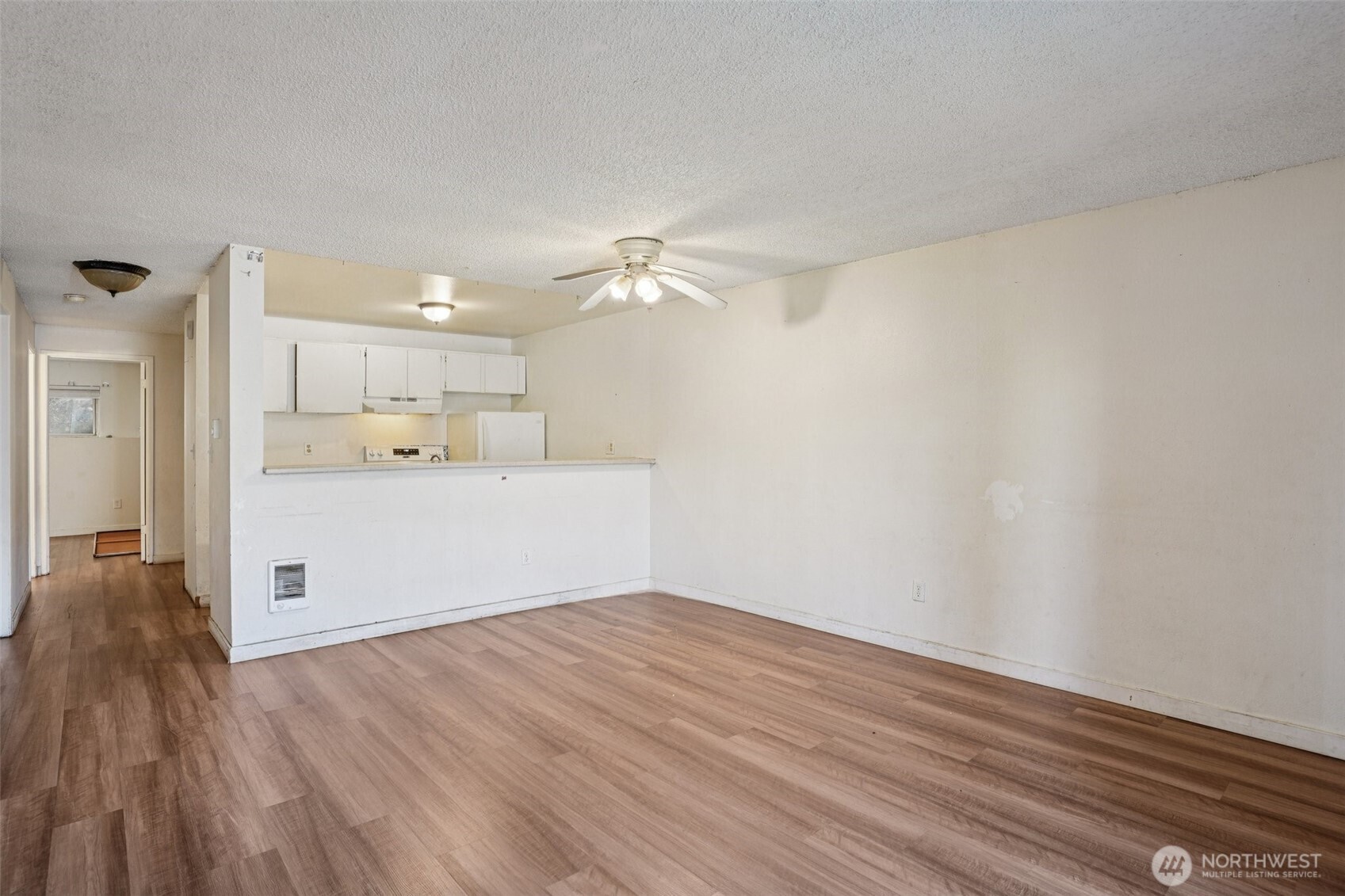 31003 14th Avenue South, Unit H8 Federal Way, WA 98003 - Photo 7 of 17 a view of a kitchen with wooden floor and a sink