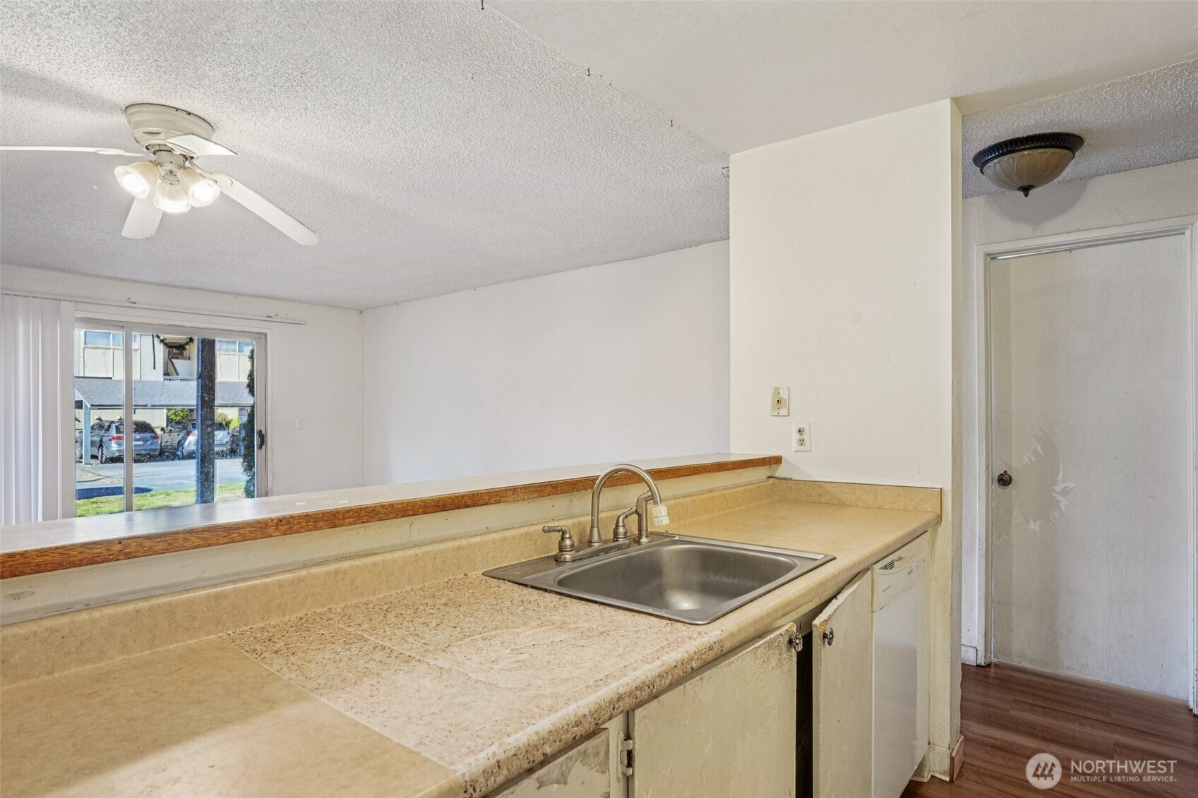 31003 14th Avenue South, Unit H8 Federal Way, WA 98003 - Photo 10 of 17 a kitchen with a sink and a refrigerator