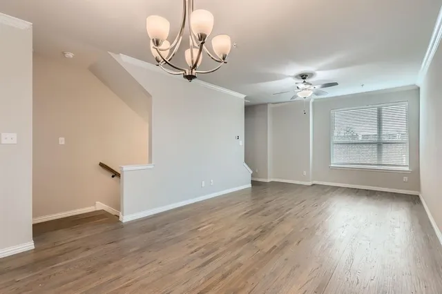 a view of a kitchen with a sink and a window