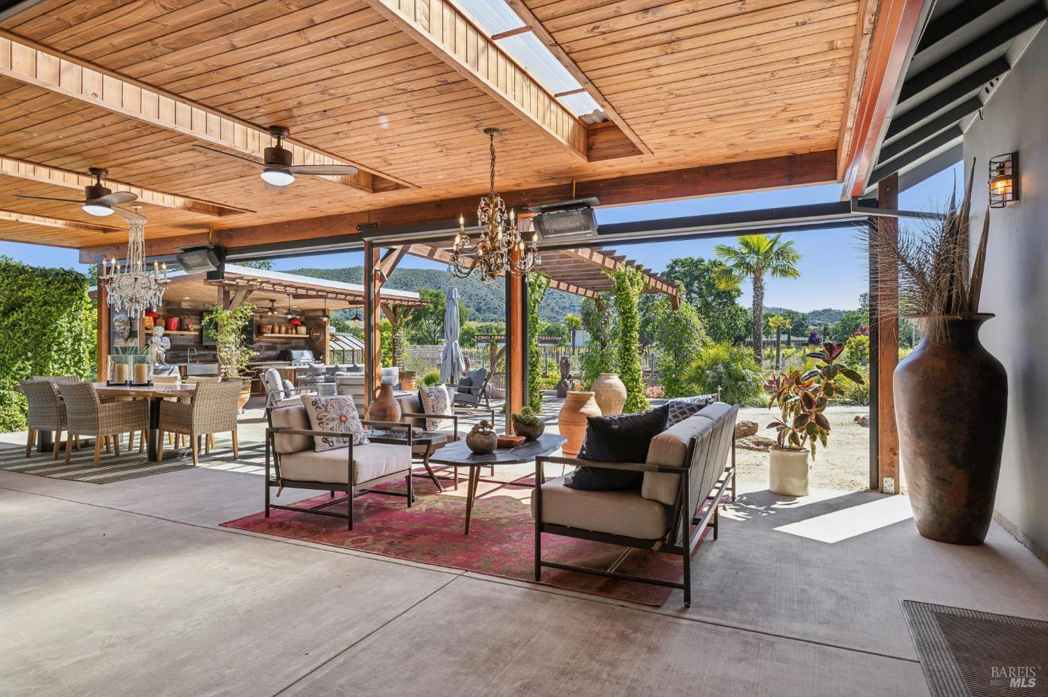 21117 Burndale Road Sonoma, CA 95476 - Photo 11 of 48 a view of a patio with a table and chairs
