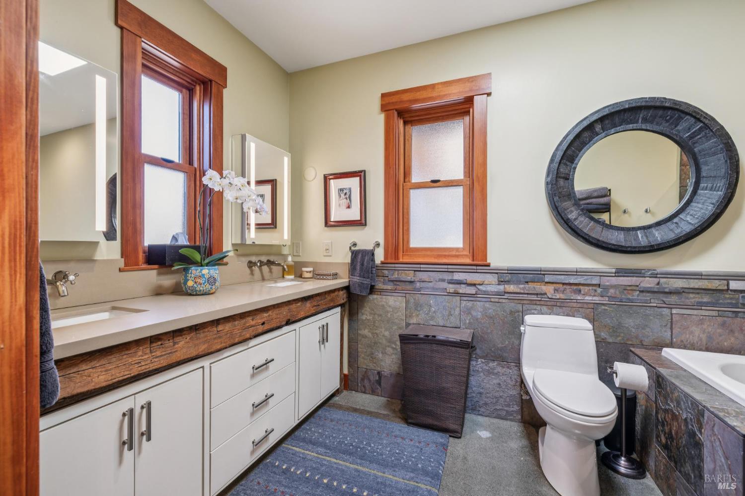 21117 Burndale Road Sonoma, CA 95476 - Photo 18 of 48 a bathroom with a toilet a sink and a mirror