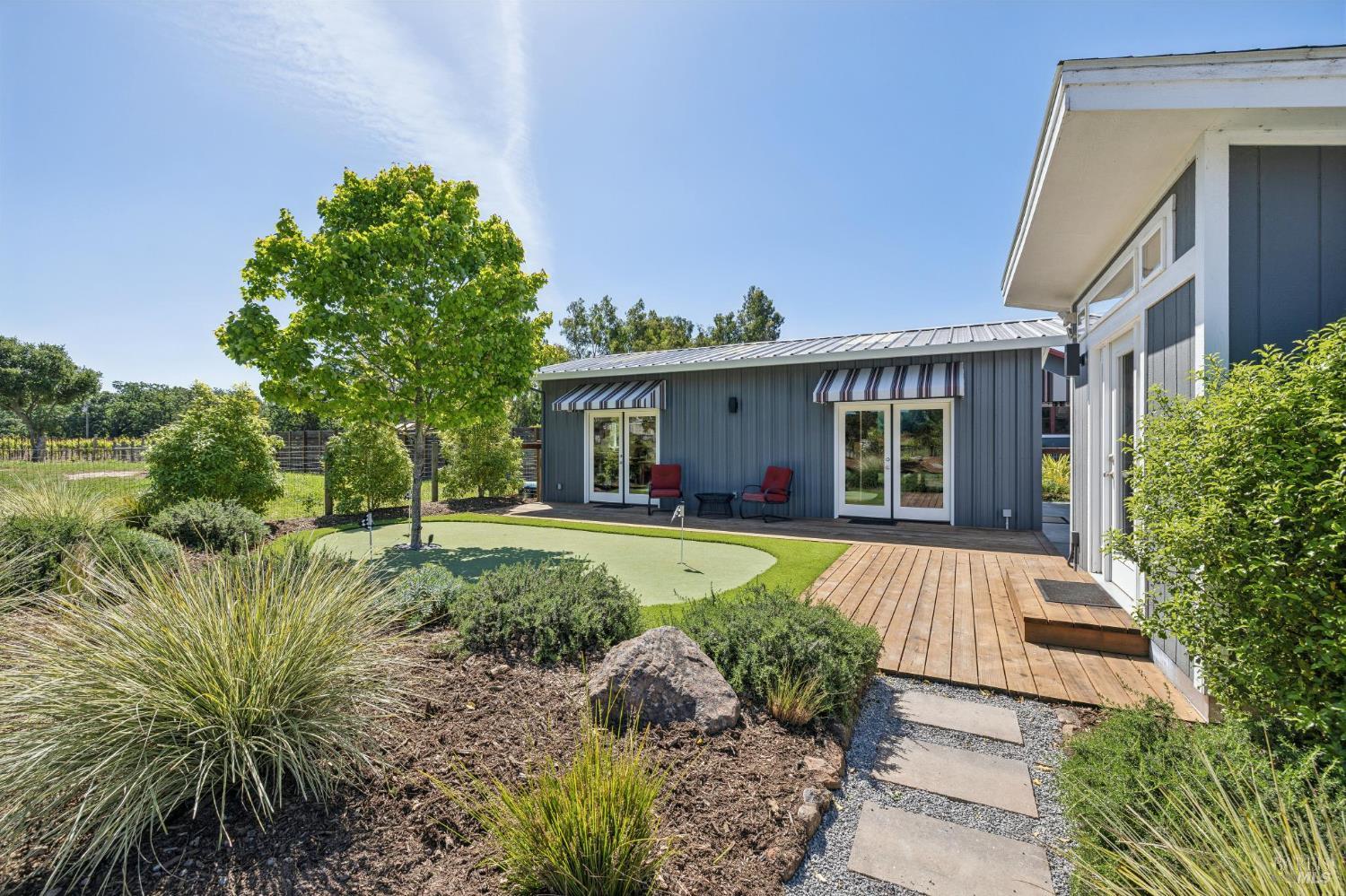 21117 Burndale Road Sonoma, CA 95476 - Photo 27 of 48 a front view of a house with a garden