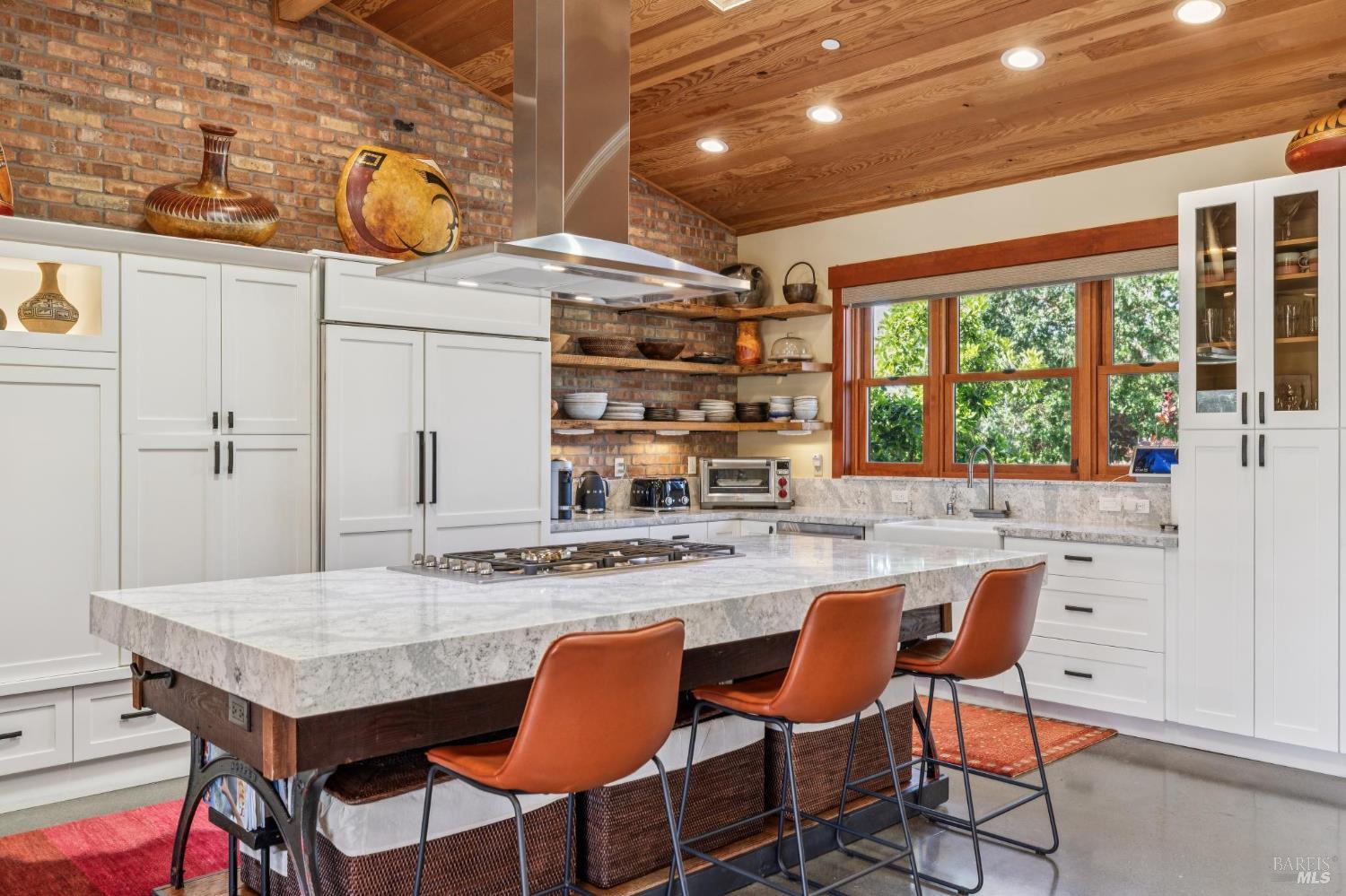 21117 Burndale Road Sonoma, CA 95476 - Photo 7 of 48 a kitchen with a table and chairs in it