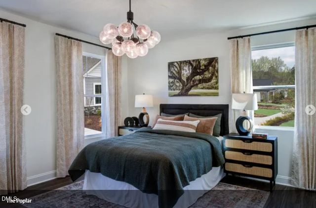 a bedroom with bed and a window