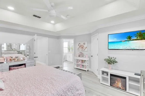 a spacious bedroom with a bed and a couch