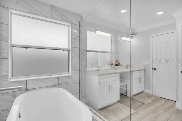 a bathroom with a sink a toilet a large mirror and shower