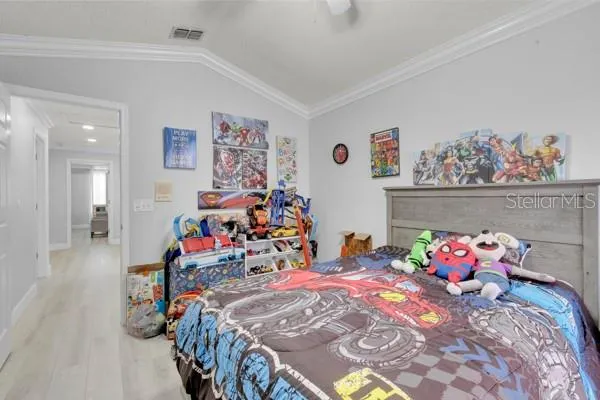 a bedroom with bed and furniture