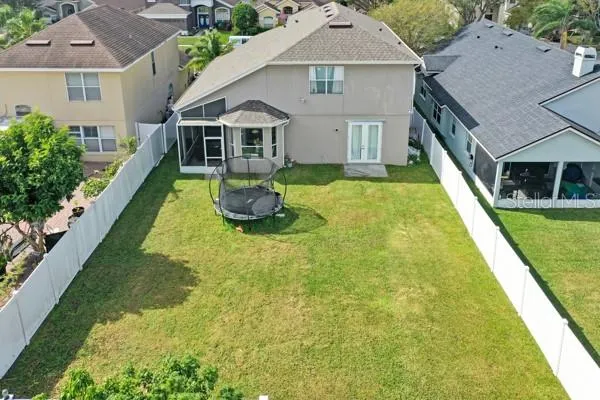 a aerial view of a house with swimming pool