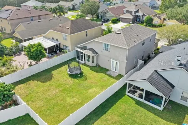 an aerial view of a house with swimming pool