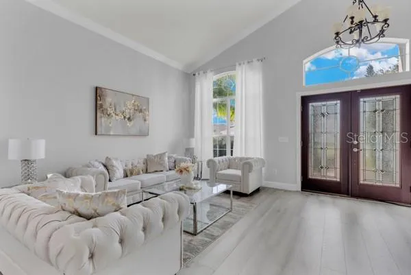 a bedroom with furniture and wooden floor