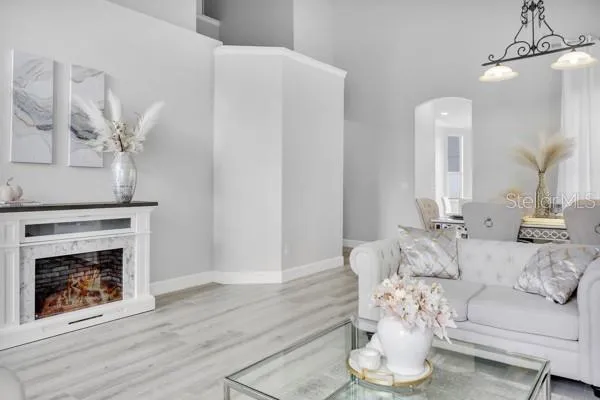 a living room with furniture and a fireplace