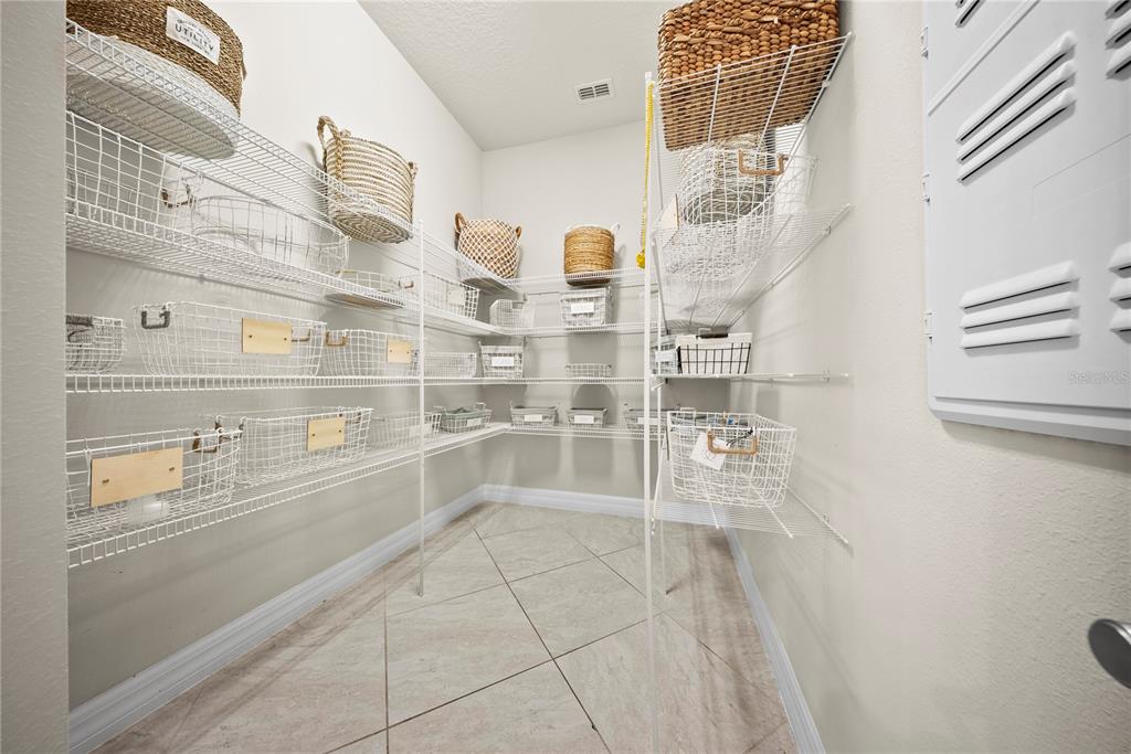 7905 Wandering Way Orlando, FL 32836 - Photo 11 of 70 a view of store room with racks on the wall