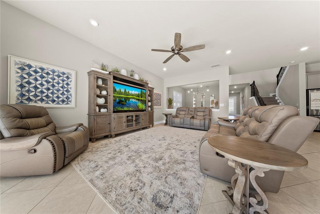 7905 Wandering Way Orlando, FL 32836 - Photo 12 of 70 a living room with furniture and a flat screen tv
