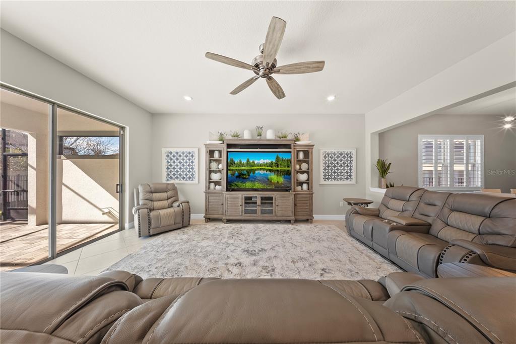 7905 Wandering Way Orlando, FL 32836 - Photo 14 of 70 a living room with furniture and a flat screen tv