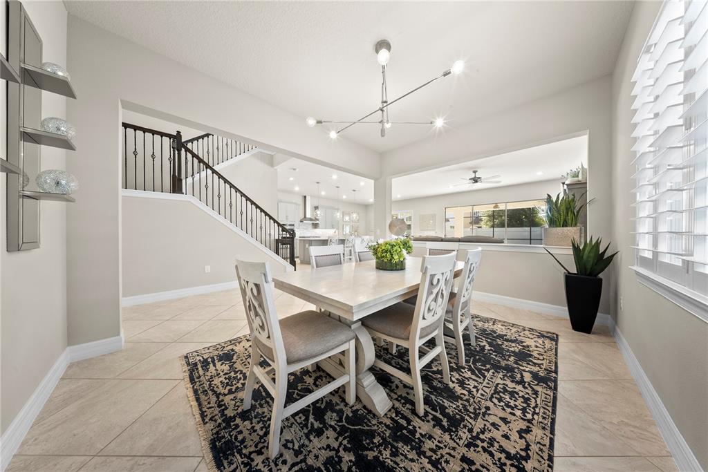 7905 Wandering Way Orlando, FL 32836 - Photo 20 of 70 a dining room with furniture and a view of kitchen