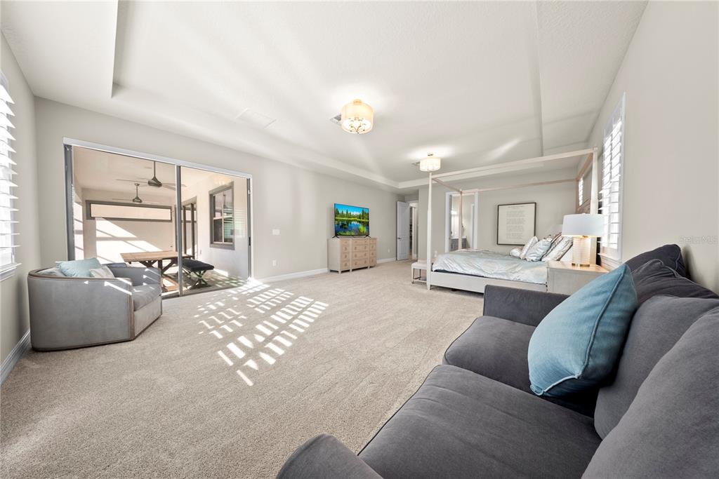 7905 Wandering Way Orlando, FL 32836 - Photo 26 of 70 a living room with furniture and wooden floor