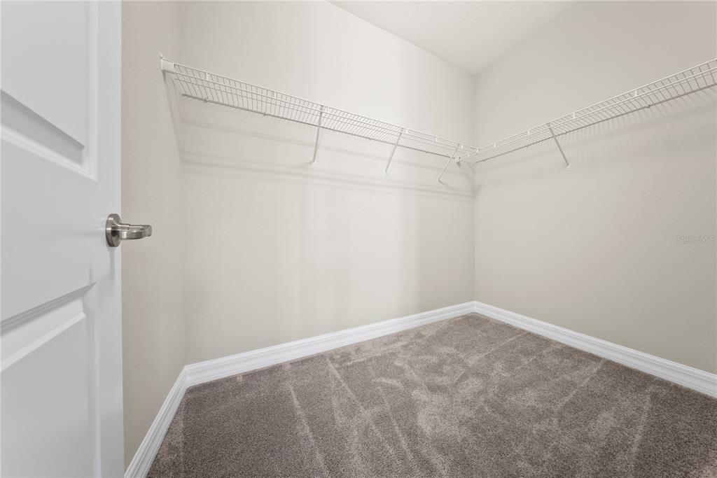 7905 Wandering Way Orlando, FL 32836 - Photo 46 of 70 a view of a room with racks on the wall