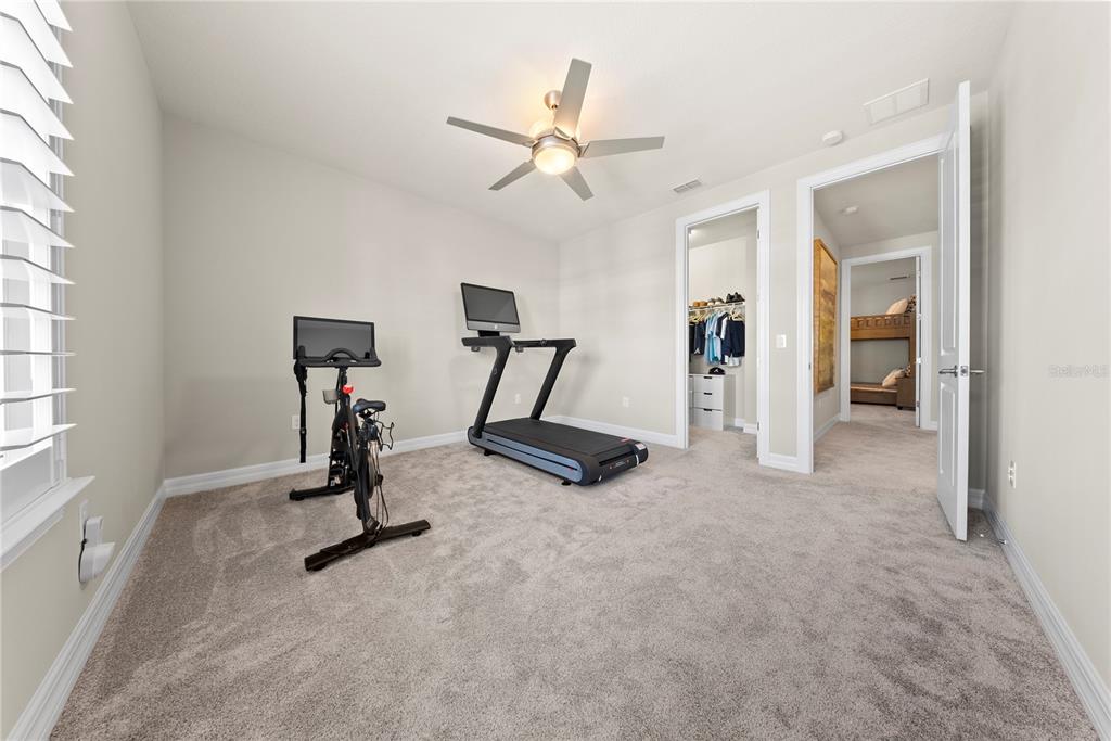 7905 Wandering Way Orlando, FL 32836 - Photo 51 of 70 a view of a room with gym equipment