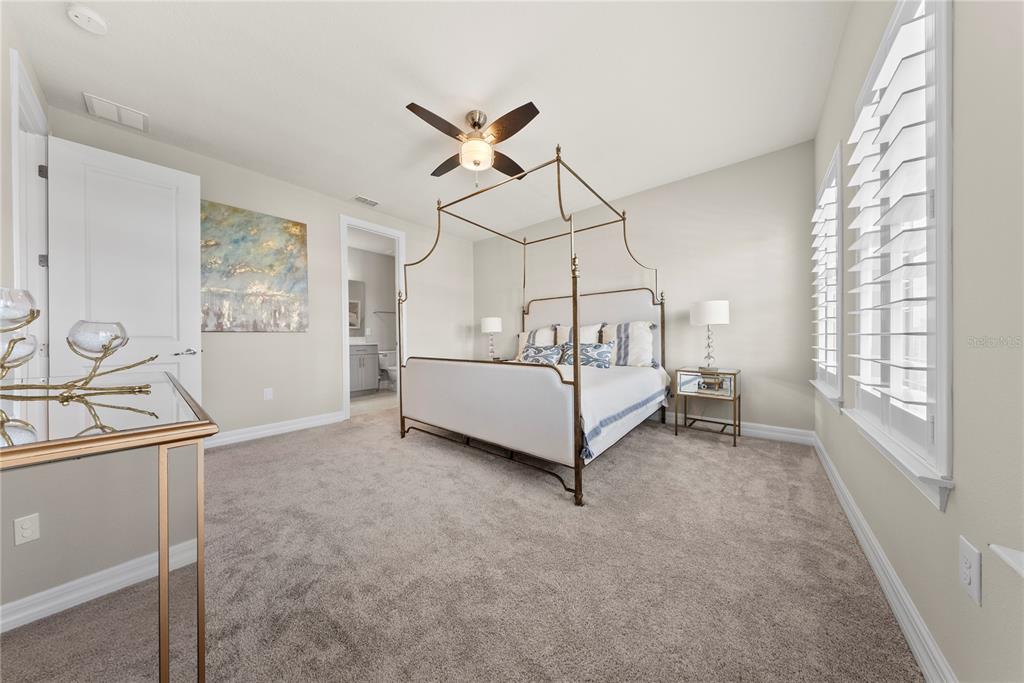 7905 Wandering Way Orlando, FL 32836 - Photo 54 of 70 a white bed sitting in a room next to a window