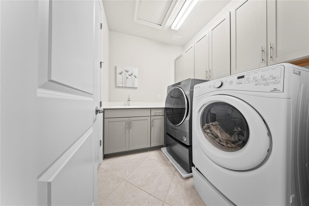 7905 Wandering Way Orlando, FL 32836 - Photo 57 of 70 a utility room with dryer and washer