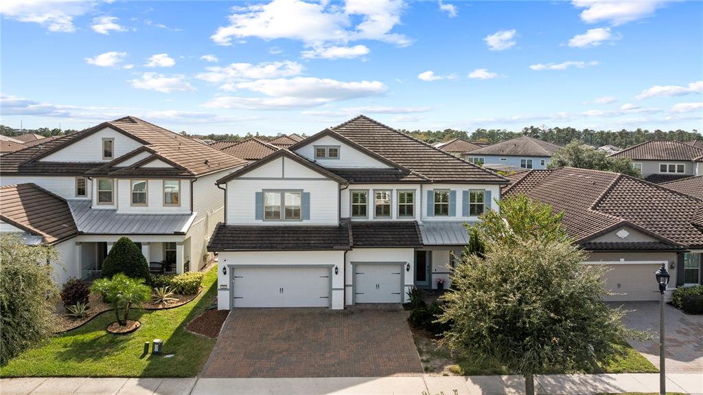 7905 Wandering Way Orlando, FL 32836 - Photo 67 of 70 a front view of a house with a yard