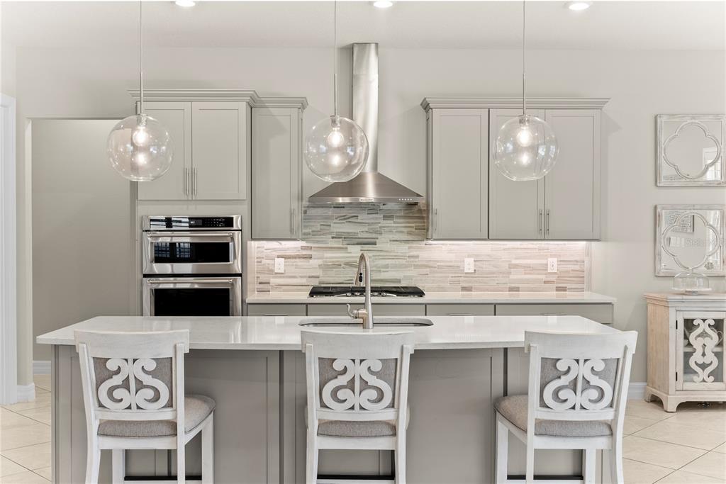 7905 Wandering Way Orlando, FL 32836 - Photo 7 of 70 a kitchen with a sink and cabinets