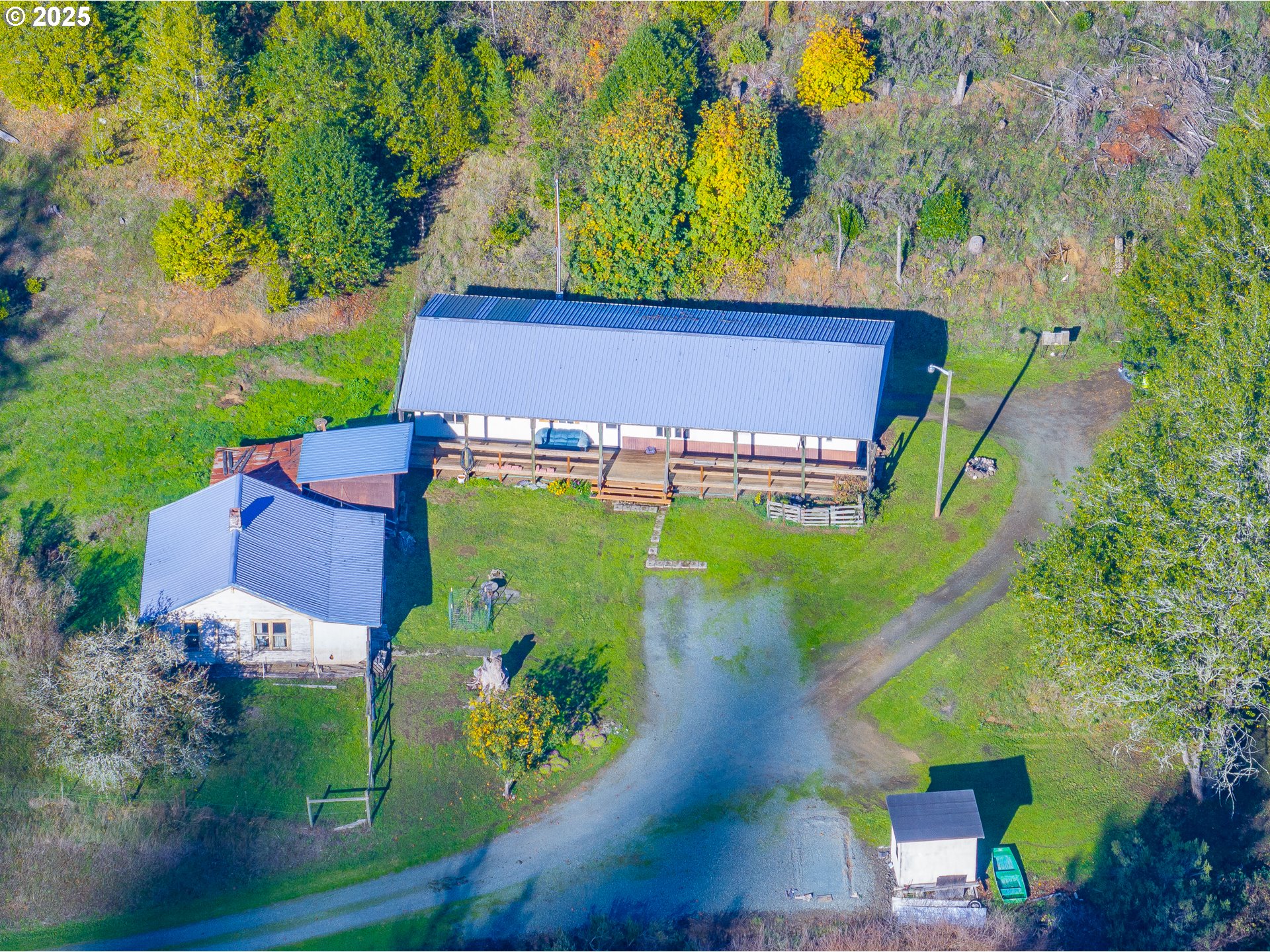 15779 Highway 42 Myrtle Point, OR 97458 - Photo 3 of 33 an aerial view of a house with a garden