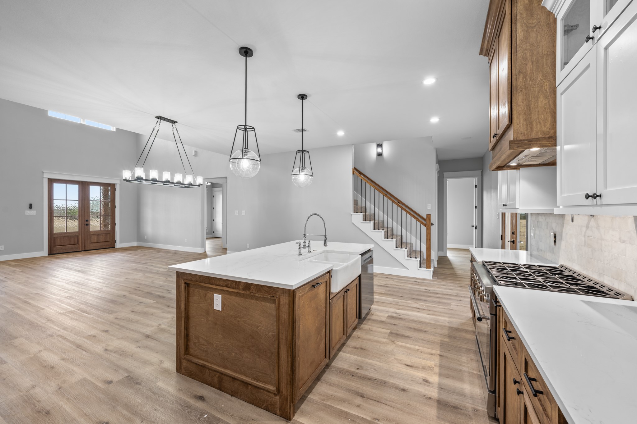 95 Longhorn Loop New Waverly, TX 77358 - Photo 17 of 50 a kitchen with a sink and stove