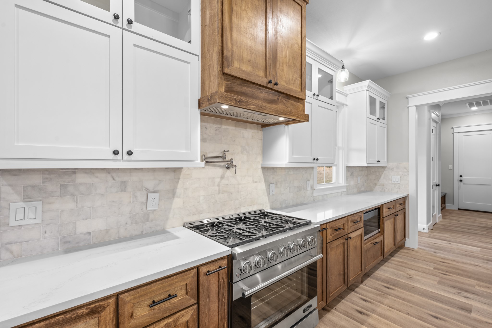 95 Longhorn Loop New Waverly, TX 77358 - Photo 18 of 50 a kitchen with stainless steel appliances granite countertop a stove a sink and a refrigerator