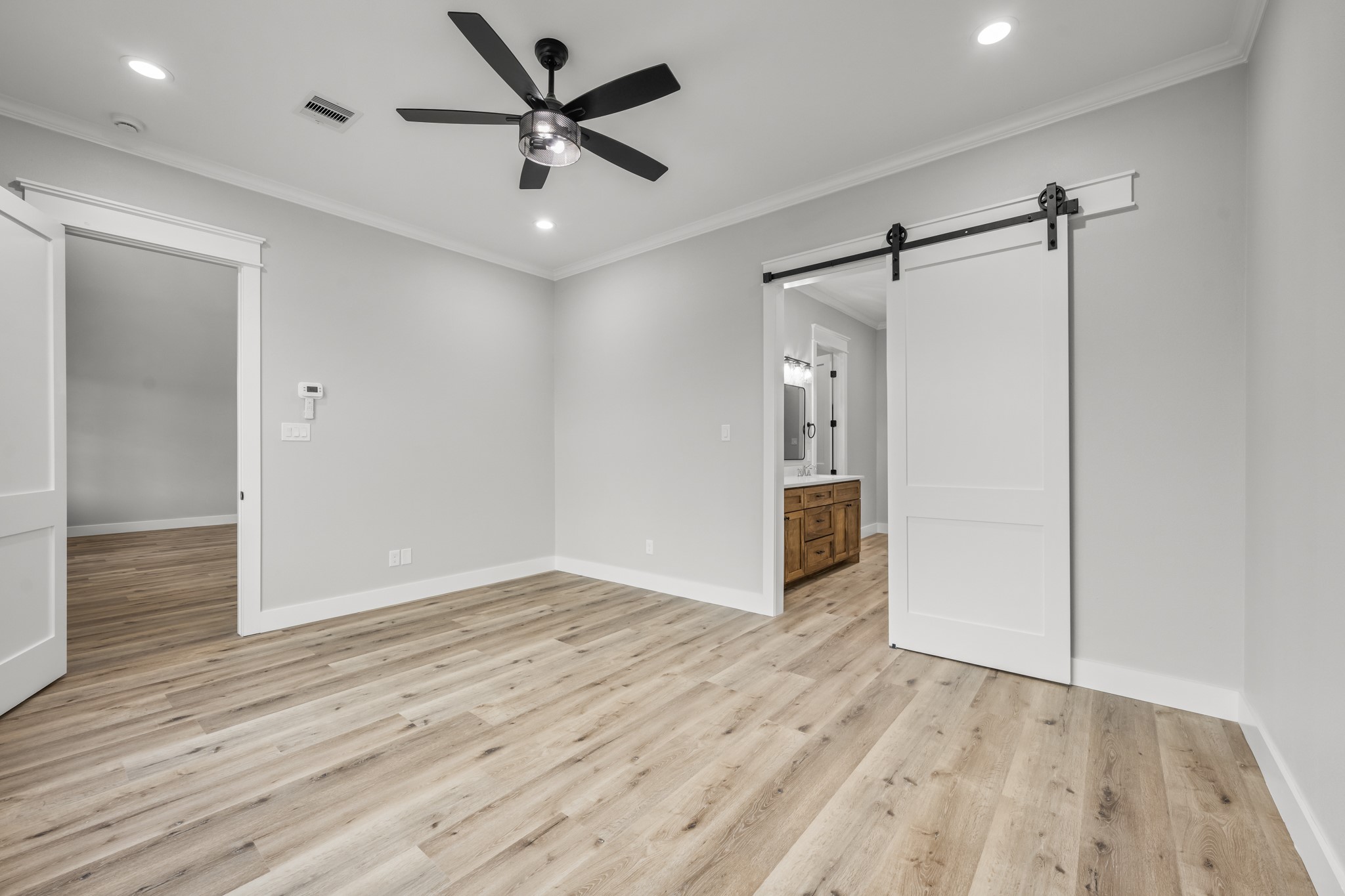 95 Longhorn Loop New Waverly, TX 77358 - Photo 23 of 50 a view of an empty room and wooden floor