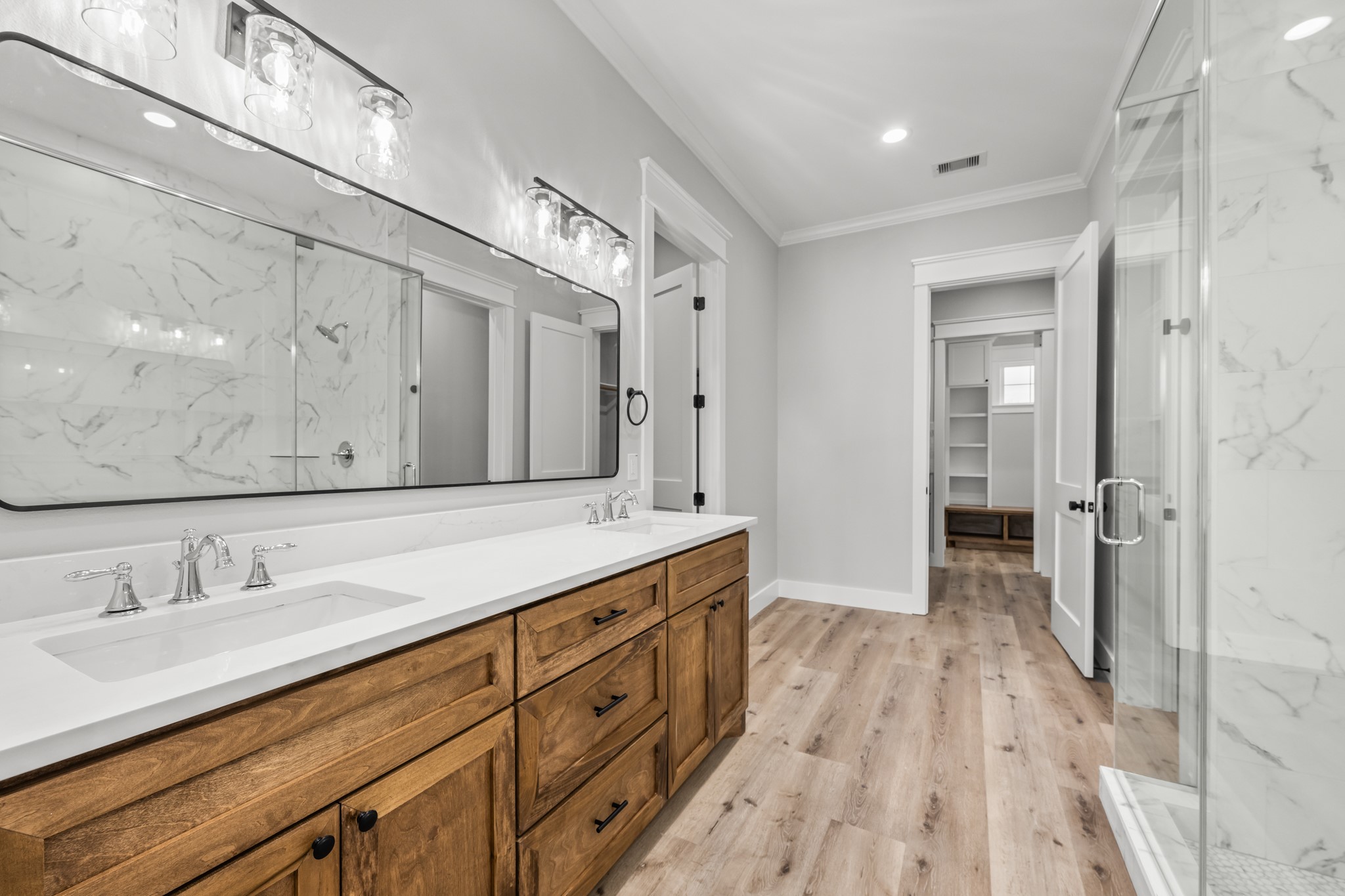 95 Longhorn Loop New Waverly, TX 77358 - Photo 26 of 50 a spacious bathroom with a double vanity sink and mirror