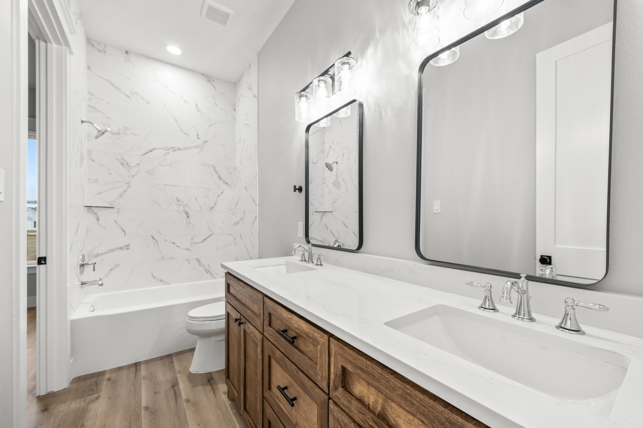 95 Longhorn Loop New Waverly, TX 77358 - Photo 30 of 50 a bathroom with a bathtub shower sink mirror and toilet