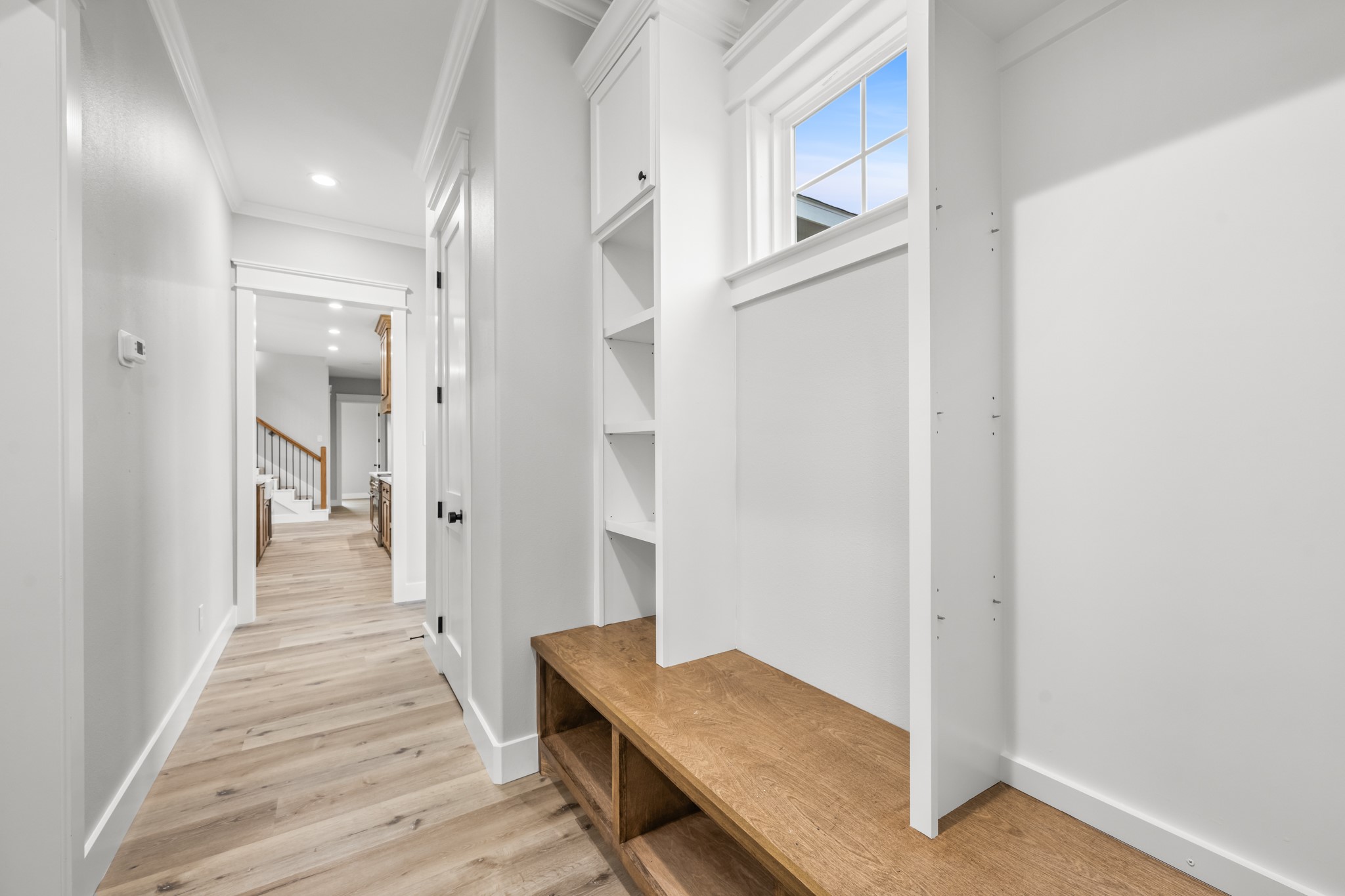95 Longhorn Loop New Waverly, TX 77358 - Photo 39 of 50 a view of a hallway with wooden floor and staircase